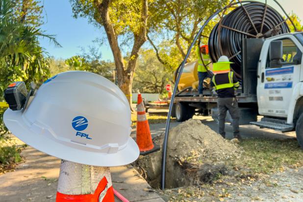 FPL workers place underground cables